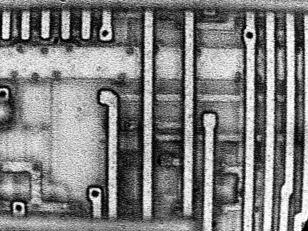 Higher magnification photograph of the missing vias shown in Figure 21. (Photo courtesy Intel Corp.)