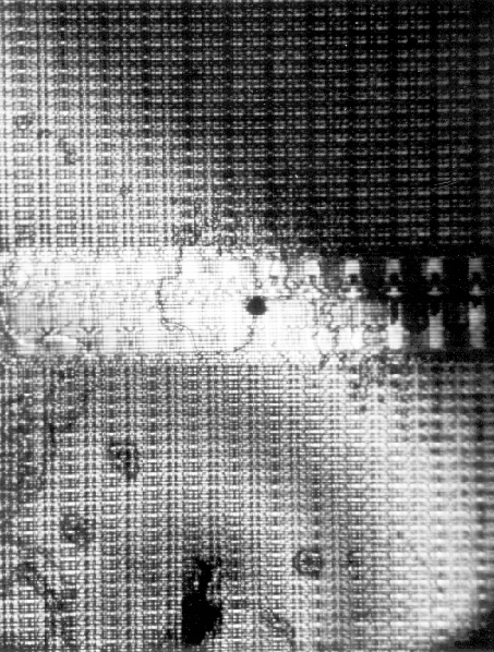 Liquid crystal analysis showing a hot spot on a memory IC. (Courtesy DM Data).