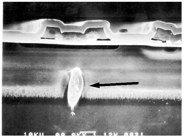 SEM image showing damage result from a collector to emitter short on a bipolar IC. (Courtesy Analytical Solutions).