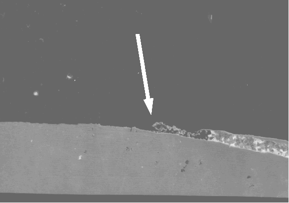 SEM image showing gap between lead and leadframe (potential entry point for moisture or other volatiles). (Courtesy Analytical Solutions).