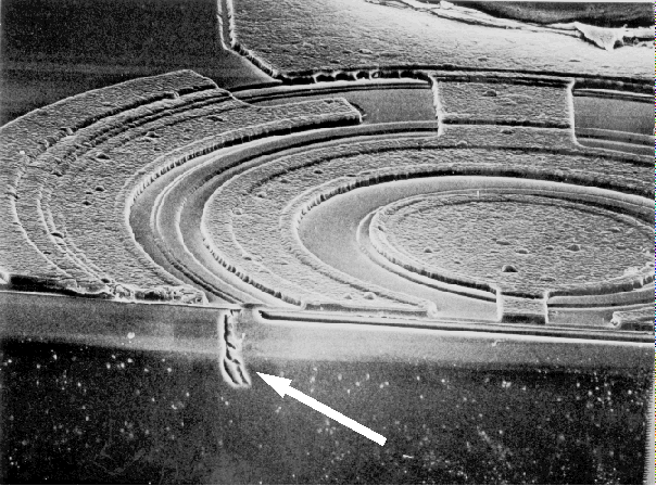 SEM image showing collector to emitter damage on a pnp transistor on a bipolar IC. (Courtesy Analytical Solutions).