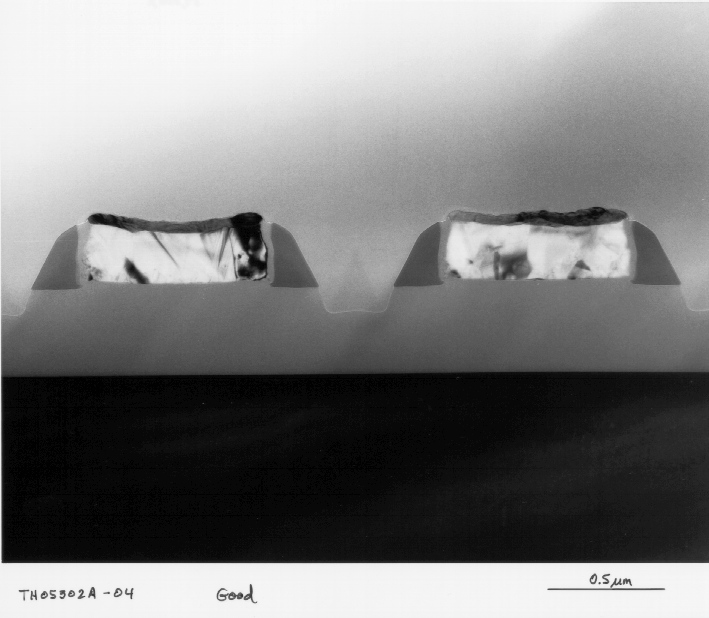 Cross-sectional view of salicide formation on polysilicon lines. Arrow indicates sufficient salicide formation.