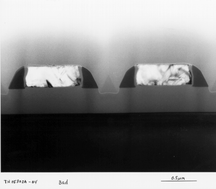 Cross-sectional view of salicide formation on polysilicon lines. Note complete lack of salicide formation.