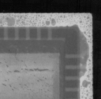 X-ray image showing a very porous and poorly wetted seal ring following lid sealing. Note that die attach detail is also revealed. (Courtesy Sandia Labs).